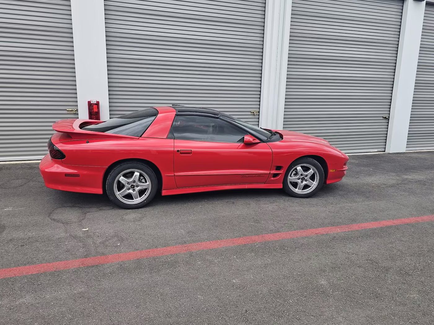 Window tint on red Pontiac Firebird - San Antonio
